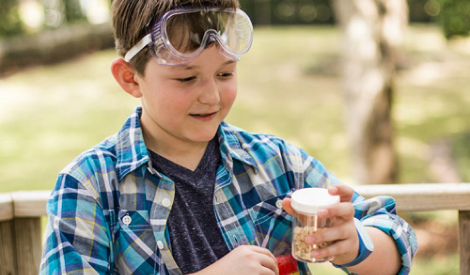 Student playing with experiments using goggles