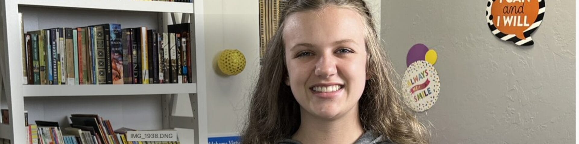 Student smiling at the camera