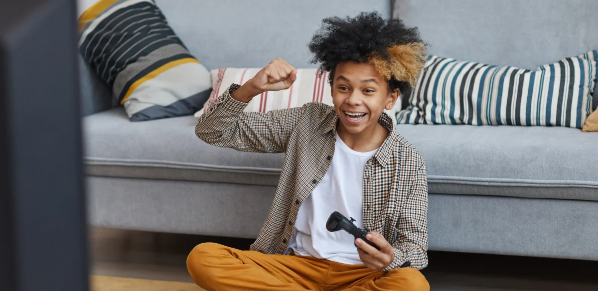 happy boy playing video games