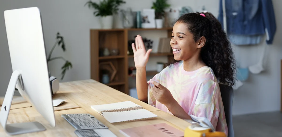 girl saying hi to the computer meeting