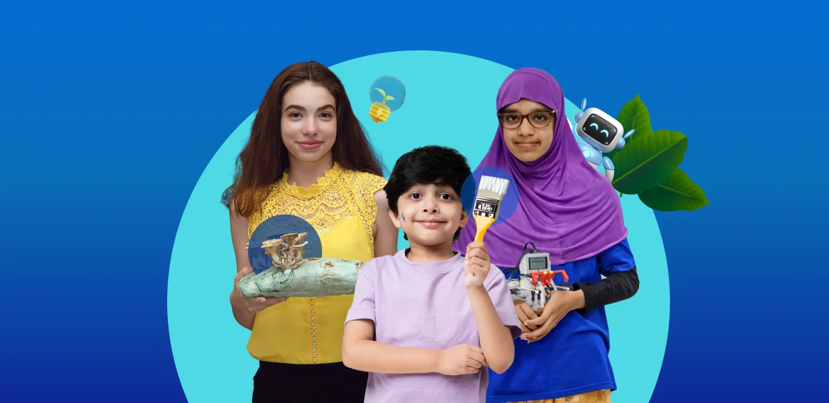 A girl with an art project, a boy with a brush and another girl holding a small robot