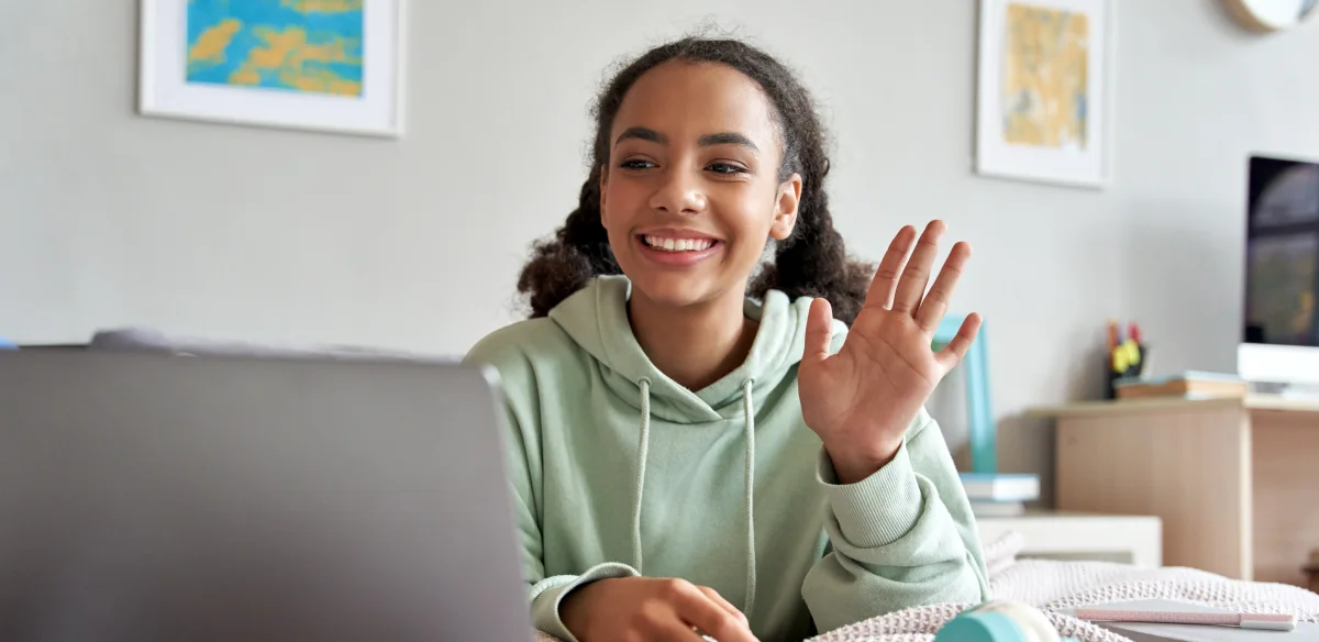girl saying hi to virtual meeting